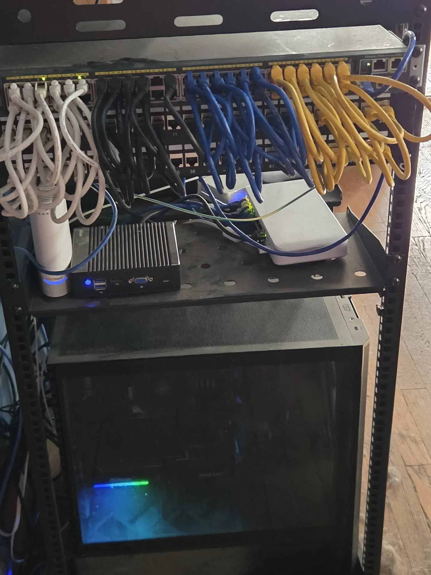 Home network, after. Rack, patch panel, and a server that stays cool